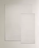 LIGHT-COLOURED WOOL RUG