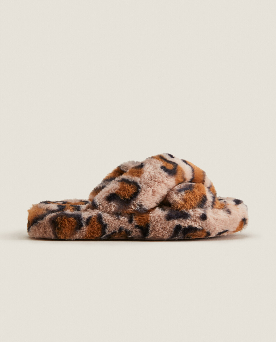 Animal print faux fur slippers.