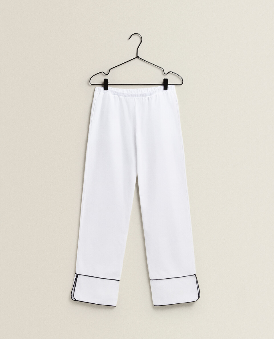 TROUSERS WITH PIPING