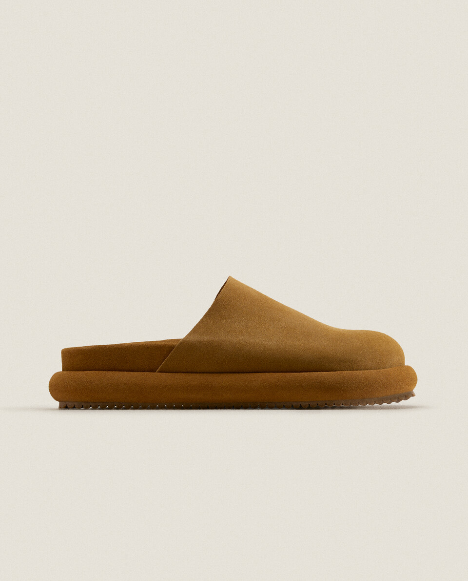 LEATHER MULE SLIPPERS WITH SOLE DETAIL