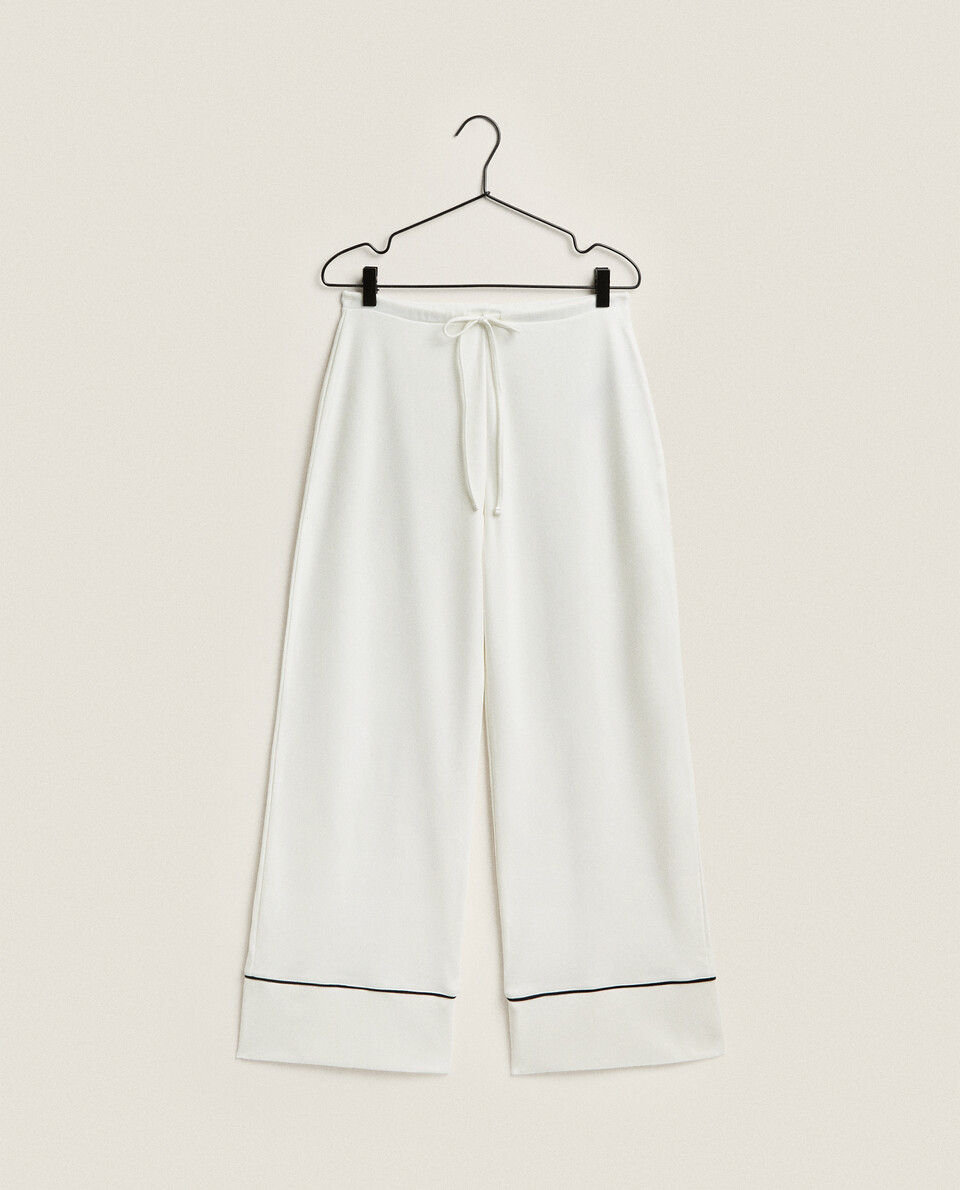 TROUSERS WITH CONTRAST PIPING