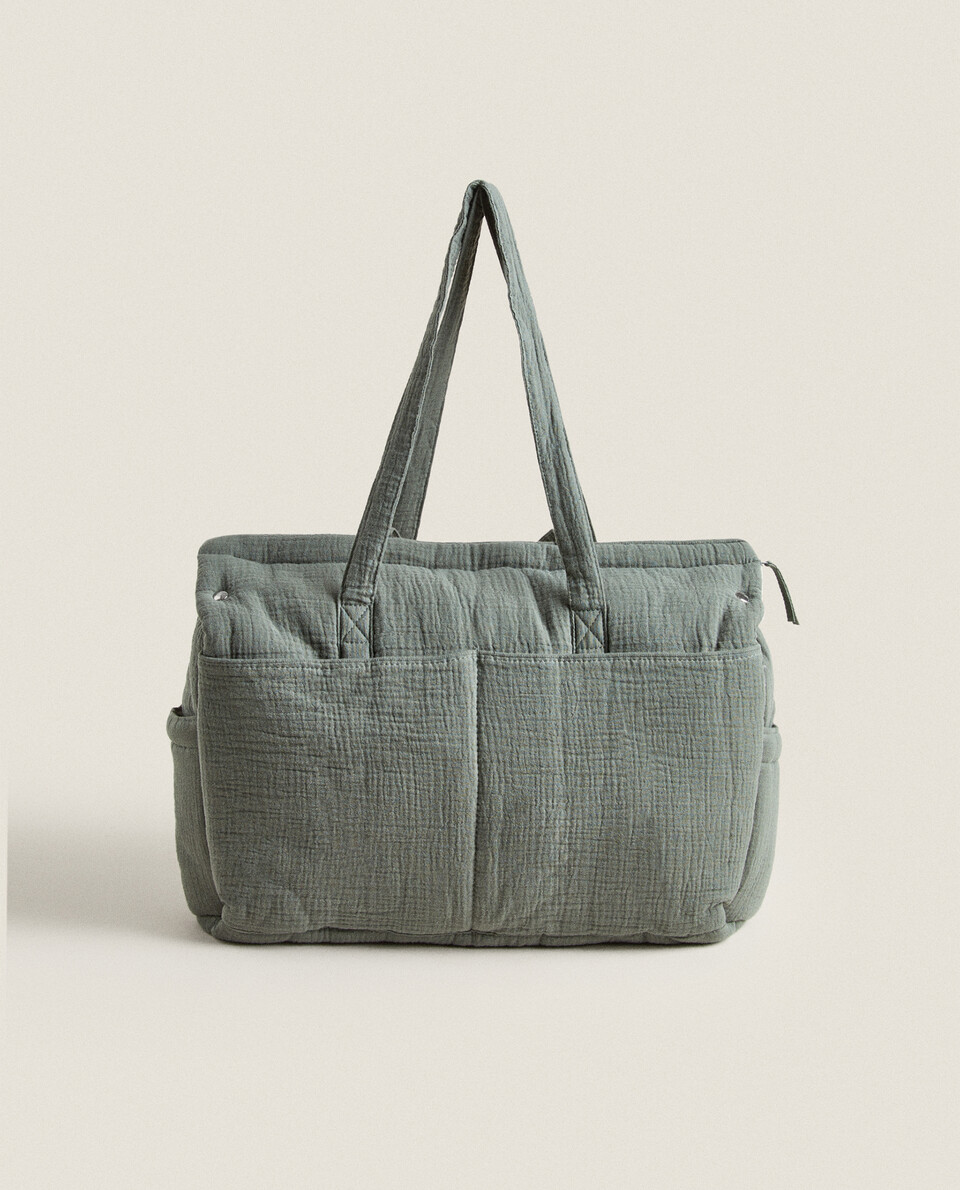 GREEN MUSLIN MATERNITY BAG