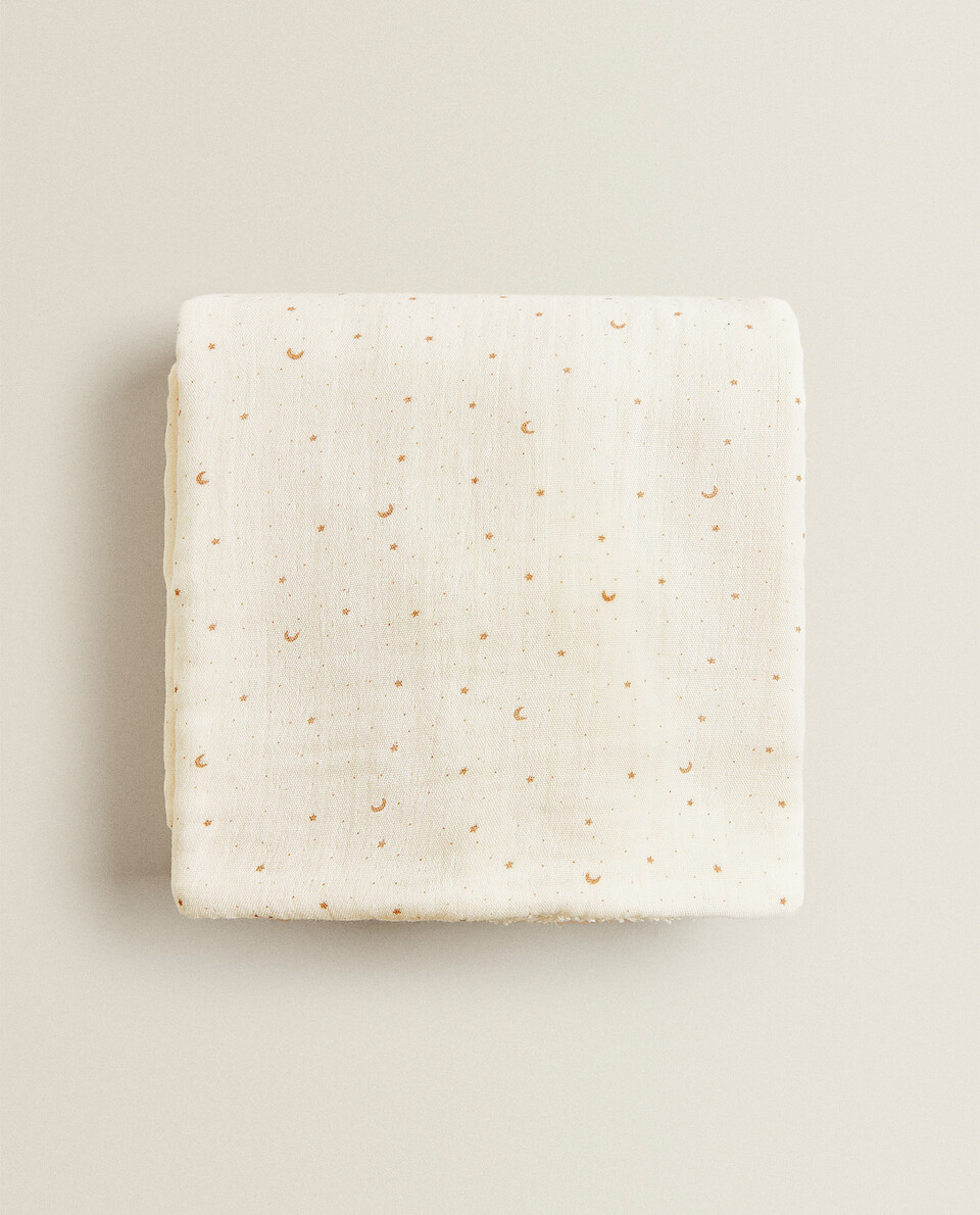 DOUBLE-SIDED TOWEL WITH MOONS AND STARS