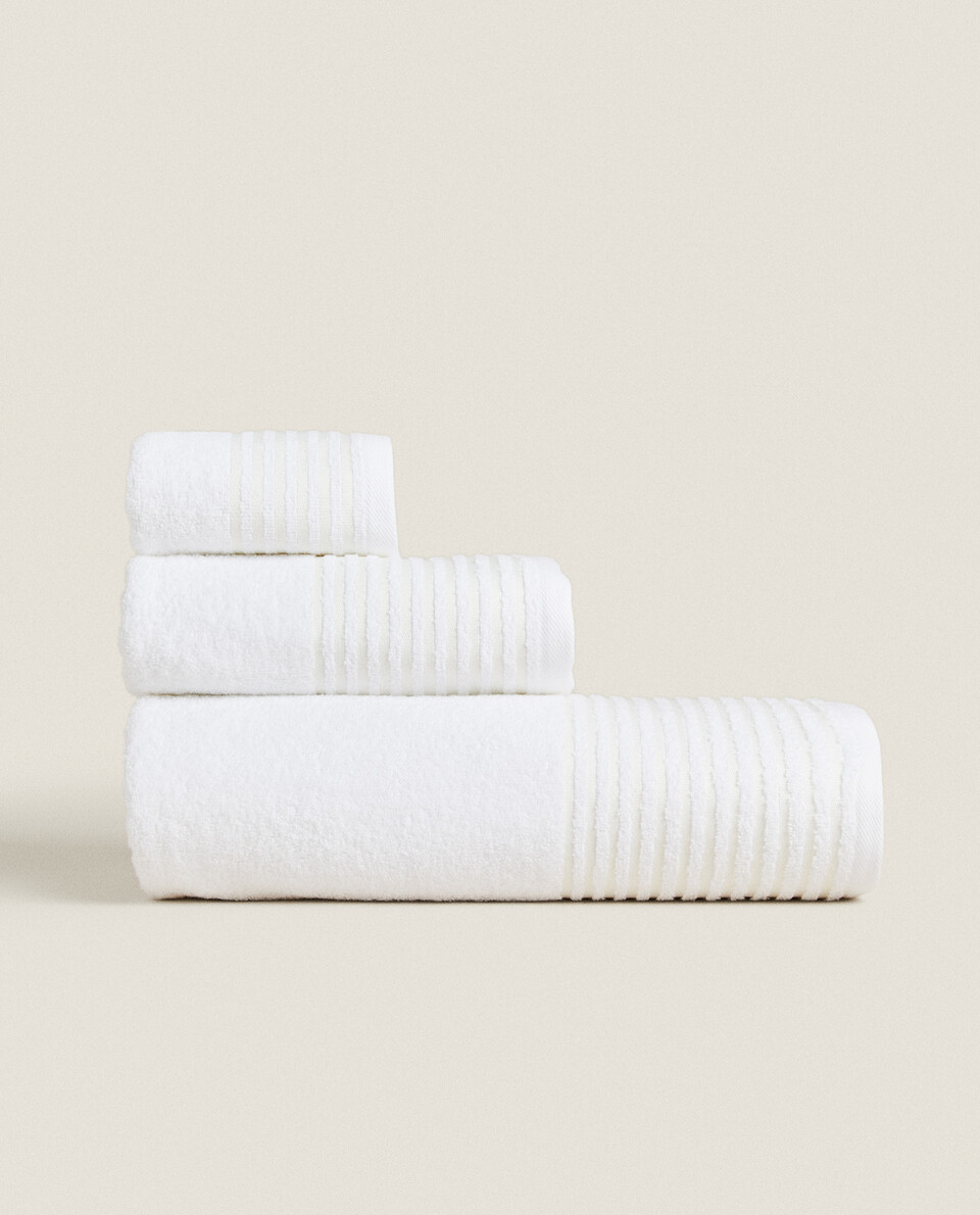 TOWEL WITH STRIPED BORDER