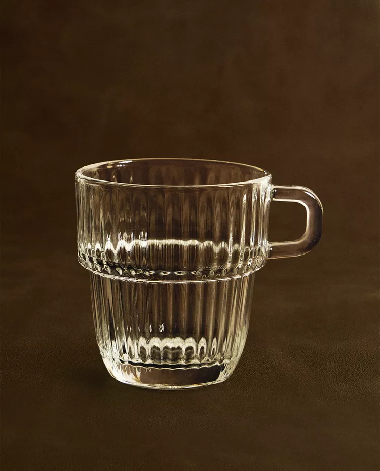 GLASS CUP WITH RAISED DESIGN