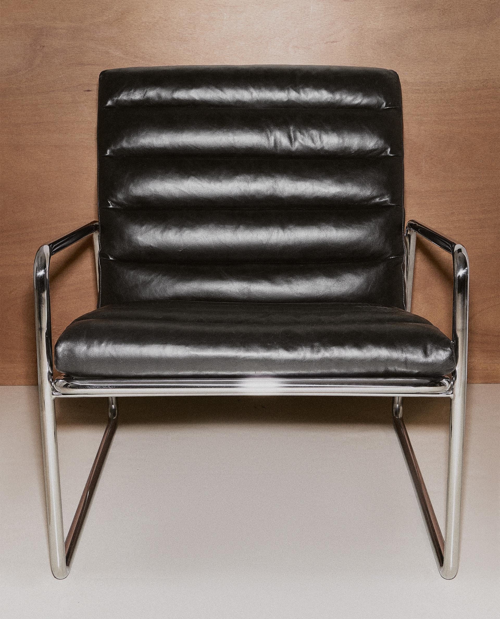 LEATHER AND STAINLESS STEEL ACCENT CHAIR LEATHER AND STAINLESS STEEL ACCENT CHAIR