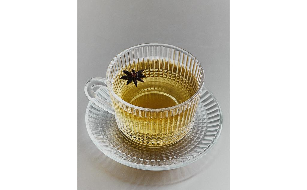GLASS TEACUP WITH RAISED GEOMETRIC DESIGN