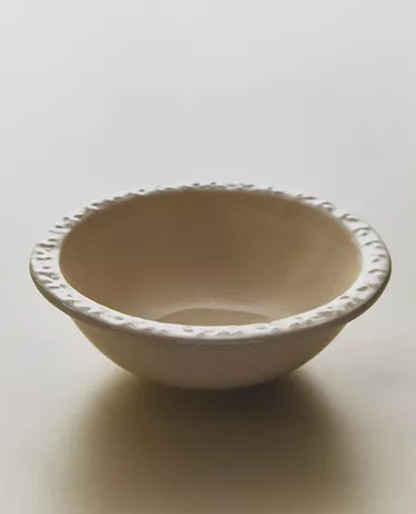 EARTHENWARE BOWL WITH RAISED-DESIGN EDGE