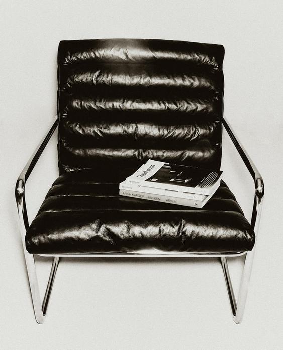 LEATHER AND STAINLESS STEEL ACCENT CHAIR