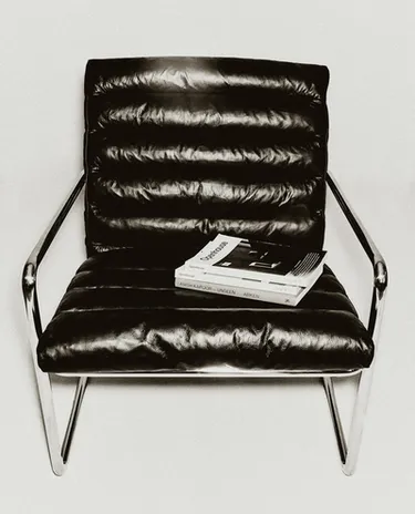 LEATHER AND STAINLESS STEEL ACCENT CHAIR