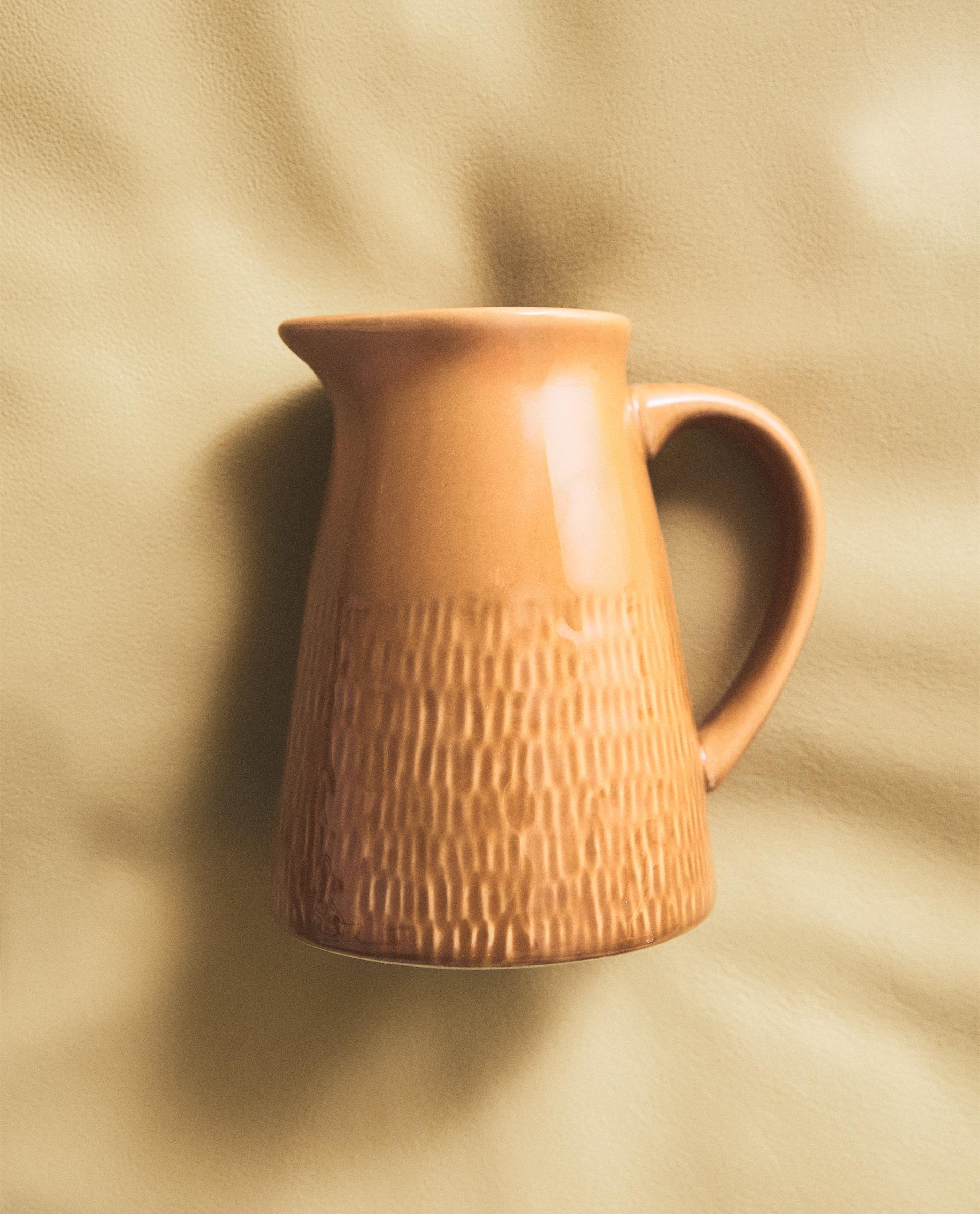 CARAMEL-COLOURED STONEWARE JUG
